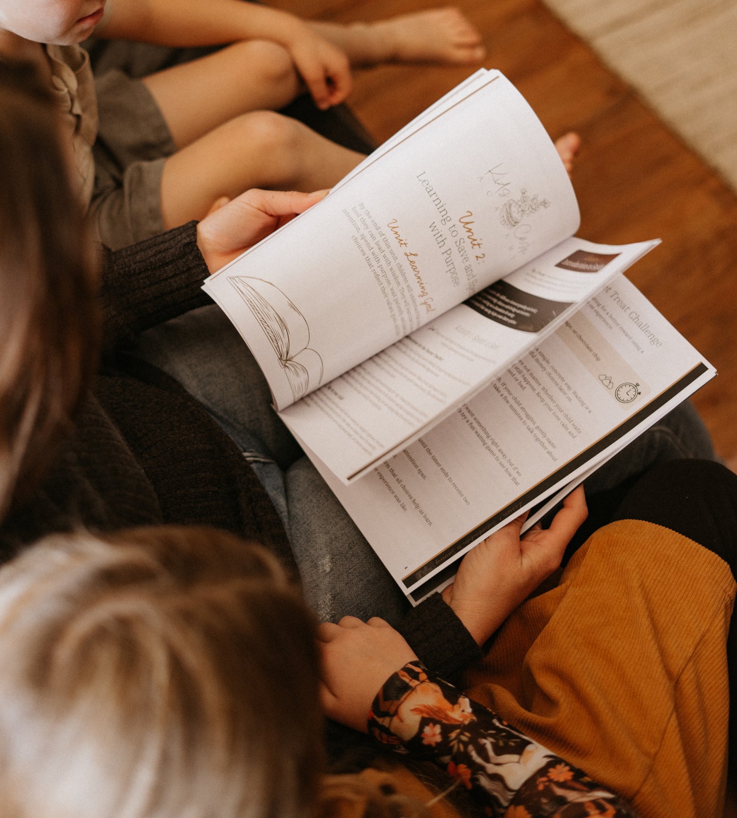 Mother reading Book One to children