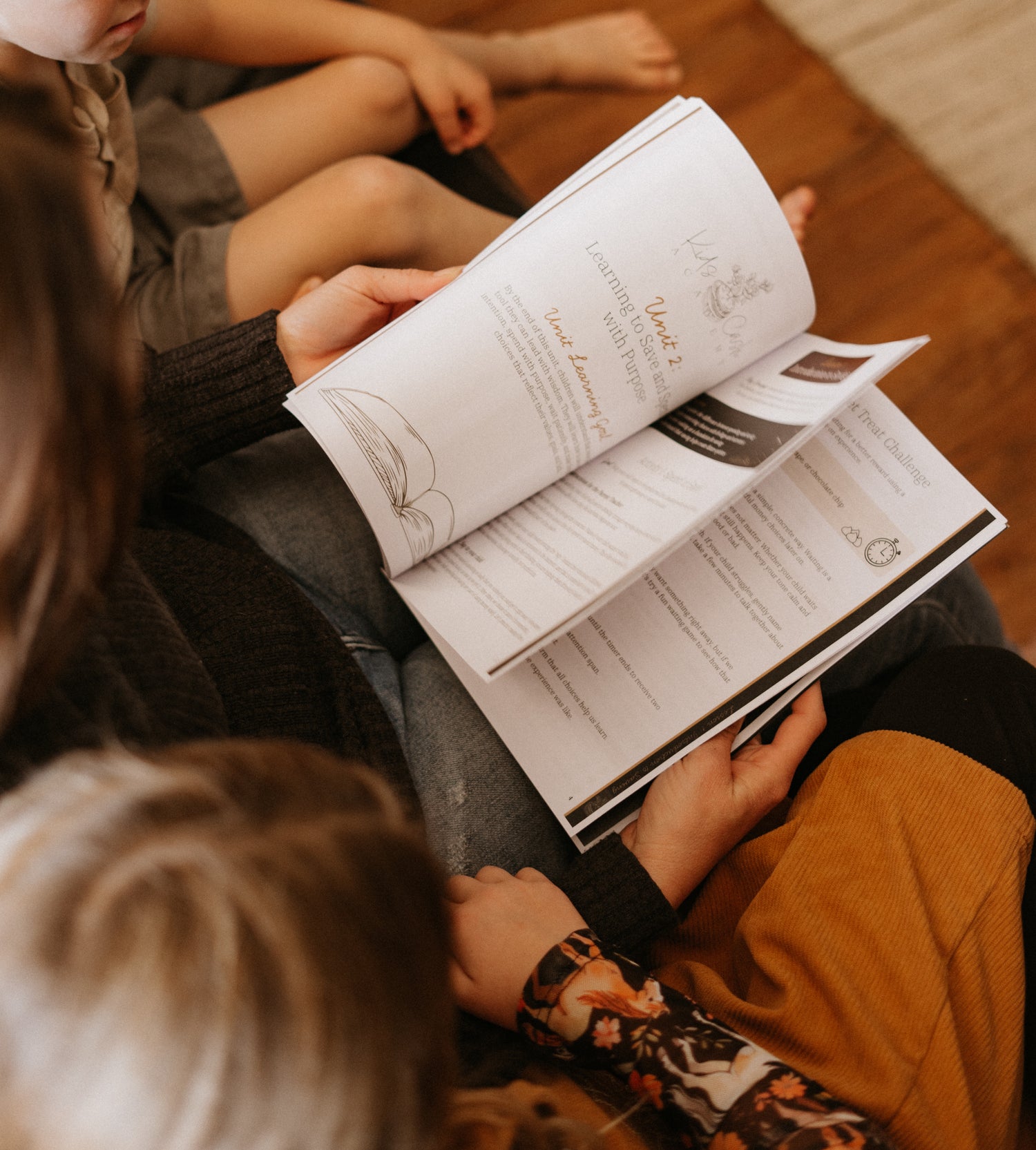 Mother reading Book One to children